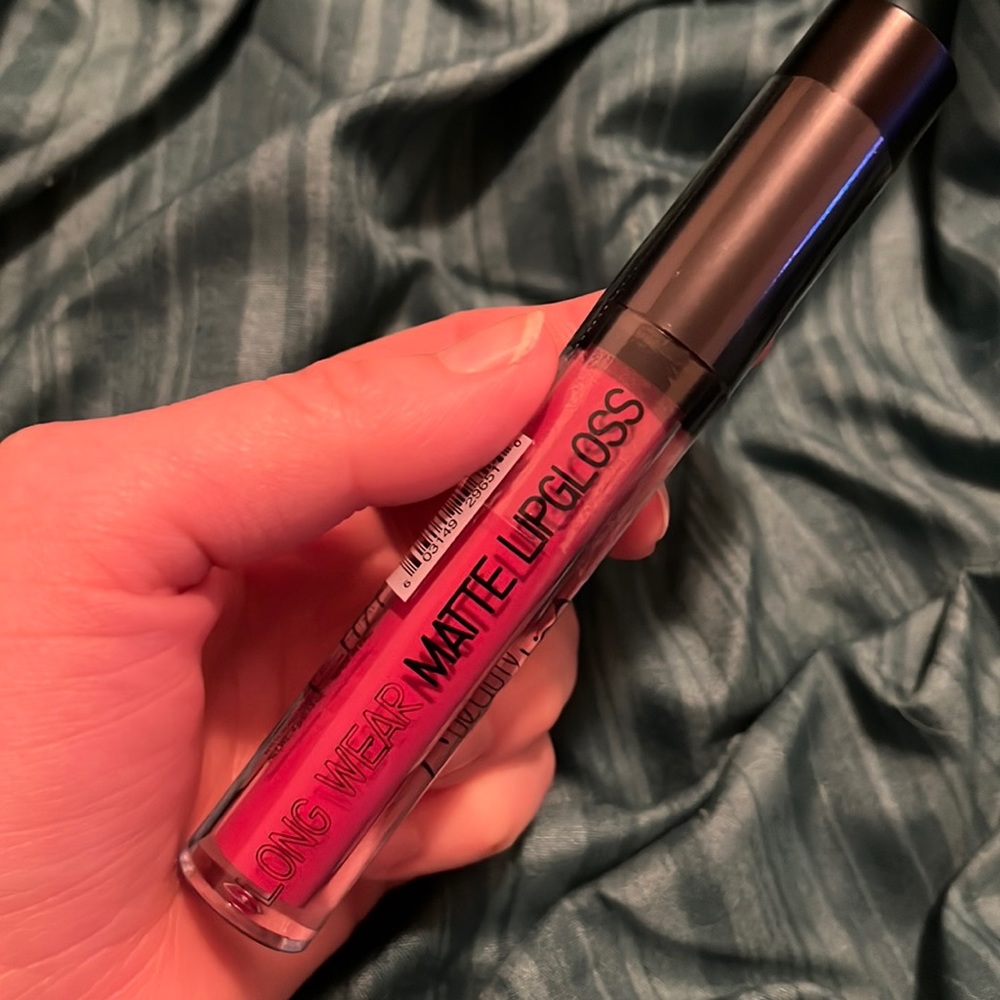 Lip gloss is a pink shade, (24 kiss me)